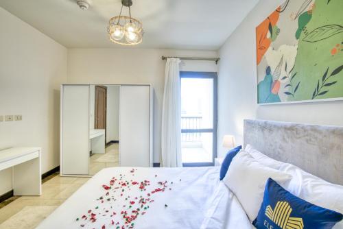a bedroom with a bed and a large mirror at LOFTS by Elegant Hospitality in Cairo