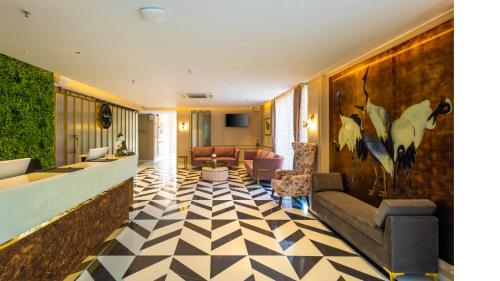 a lobby with a checkered floor at Renest Calangute Goa in Calangute