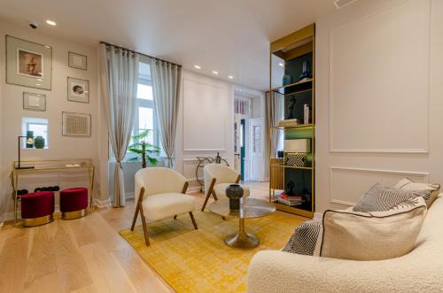 a living room with a couch and chairs and a table at BCascais Boutique House by APT IIN Cascais Center in Cascais