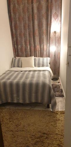 Ein Bett oder Betten in einem Zimmer der Unterkunft Tanih Place