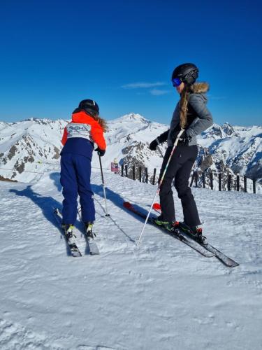 two people on skis on a snow covered mountain at Schuss Cerro Catedral ARG41 in San Carlos de Bariloche