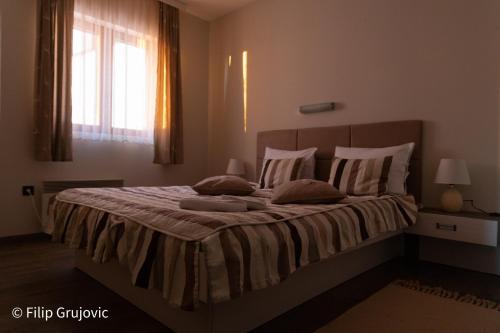 Postel nebo postele na pokoji v ubytování Apartment G6