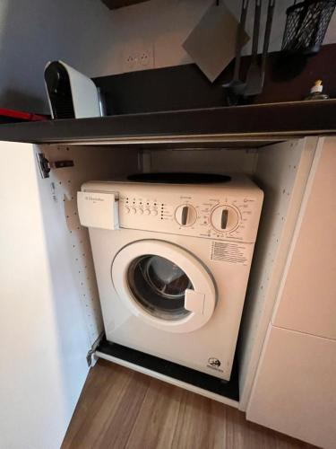 a washer and dryer in a small room at Cozy loft in Normandy in Saint-Gâtien-des-Bois
