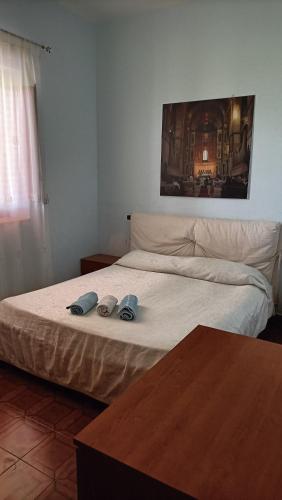 a bedroom with two beds with hats on them at LA FINESTRA SUL MARE PIANO Terra in Trappeto