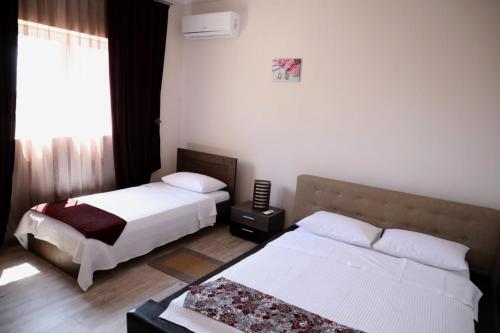Katil atau katil-katil dalam bilik di Damias rental rooms