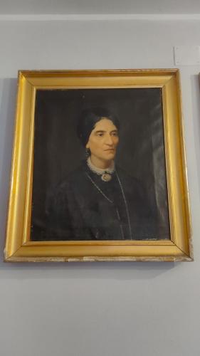a framed painting of a woman in a suit at Art action room in Villanovafranca
