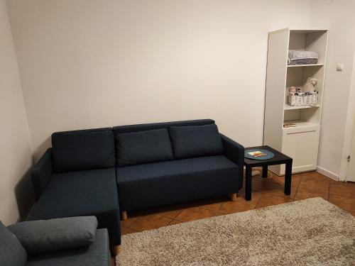 a living room with a couch and a table at Apartament - Mieszkanie Samodzielne in Inowrocław
