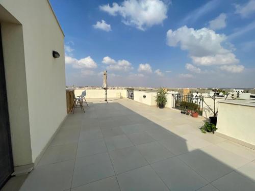 Wooden Rooftop in Sodic Eastown with free wifi & free parking & self check in