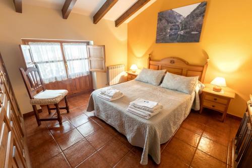 Postel nebo postele na pokoji v ubytování Apartamentos Rurales Villa-García