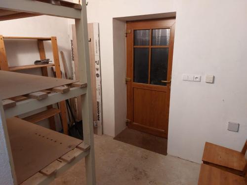 a room with a door and a window in a room at Chalupa a apartmány Marika in Cerny Dul