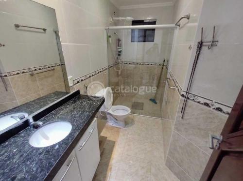 a bathroom with a shower and a sink and a toilet at Condominio com vista para o mar in Nísia Floresta