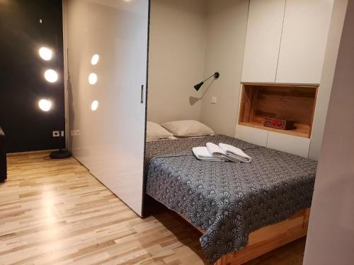 a bedroom with a bed and a mirror at Lorf Hostel&Coffee in Kraków