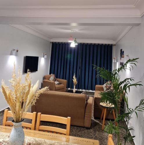 a living room with a couch and a table at Nour 1 in Alexandria