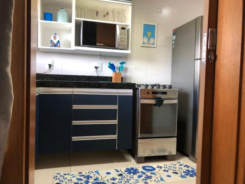 Kuchyň nebo kuchyňský kout v ubytování Apartamento Praia Grande
