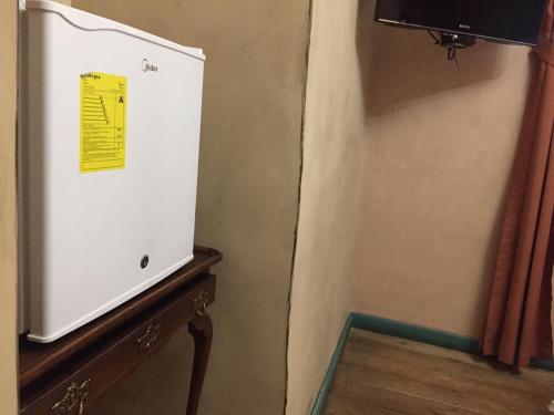 TV a/nebo společenská místnost v ubytování Hotel Ines Maria