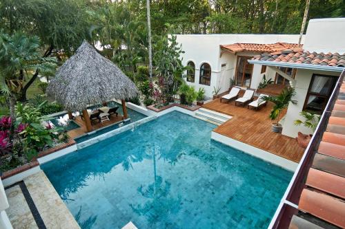 a swimming pool in the backyard of a house at Oceana - Beachfront Villa in Mal País