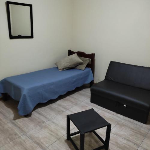 Säng eller sängar i ett rum på Pousada Casa Valério