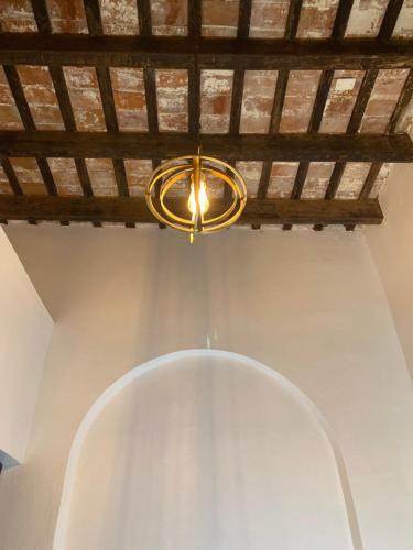 a light hanging from a ceiling in a room at 352 Guest House Hotel Boutique in San Juan