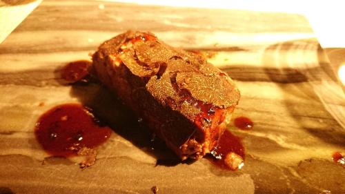 a piece of chocolate cake sitting on a table at HAKONE NICA in Hakone