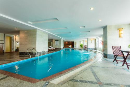 a large swimming pool in a hotel room at Muong Thanh Grand Hanoi Hotel in Hanoi
