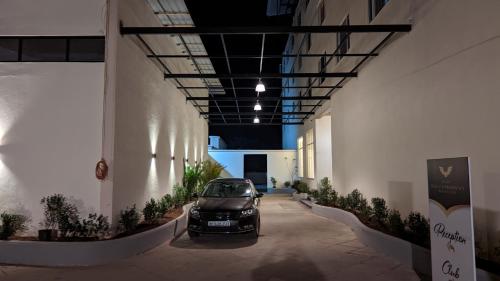 a car parked in a hallway in a building at Mayur Belgaum Presidency Hotel & Spa in Belgaum