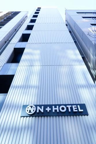 a sign on the side of a building at N Plus Hotel Akihabara in Tokyo