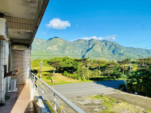 a balcony of a building with a view of a mountain at Green sea House in Changbin