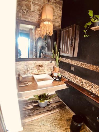 a kitchen with a sink and a mirror at Romance in Ella in Ella