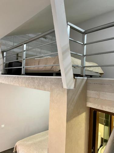 a room with two bunk beds and a staircase at Family room in Bakuriani in Bakuriani
