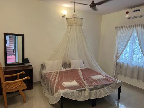 Krevet ili kreveti u jedinici u okviru objekta Kuppath Inn