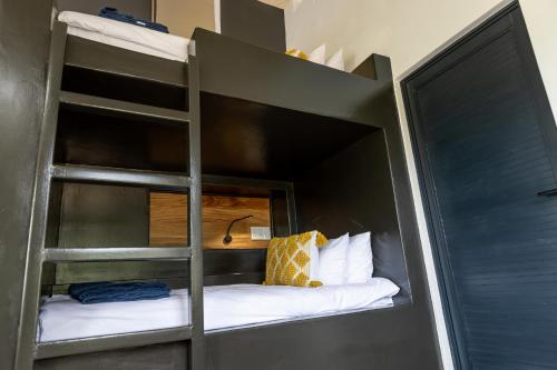 a bunk bed with a ladder in a room at Belvidere Country Estate in Karkloof Nature Reserve