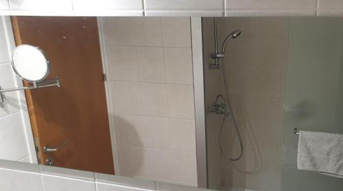 a bathroom with a shower with a mirror at LINA'S HOME & POOL - Breakbooking CY in Laxia