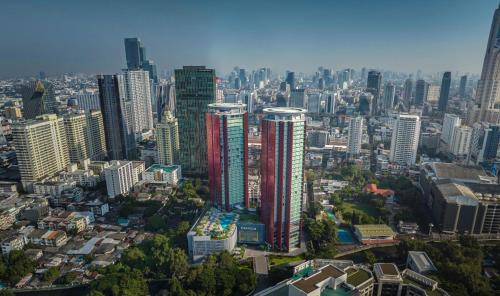 an aerial view of a city with tall buildings at Chatrium Grand Bangkok in Bangkok