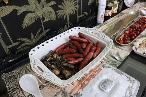 a plate of food with carrots and other foods at Villa Grande Luxury accommodation in Welkom