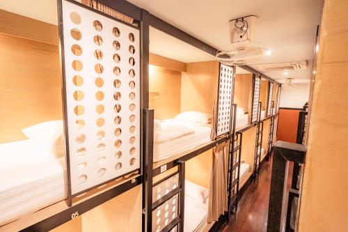 Ένα ή περισσότερα κρεβάτια σε δωμάτιο στο The Dorm Hostel