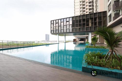 a swimming pool in the middle of a building at Bali Residence Malacca Premium By I Housing in Melaka