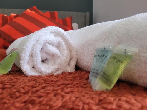 a towel and a tube of toothpaste on a bed at Luke Stays - Rokeby Street in Lemington