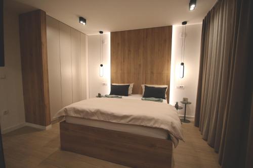 a bedroom with a large bed in a room at TOP Room in Šabac