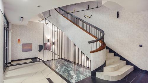 a staircase in a building with a glass floor at Plac Unii, Sun & Snow in Gdynia