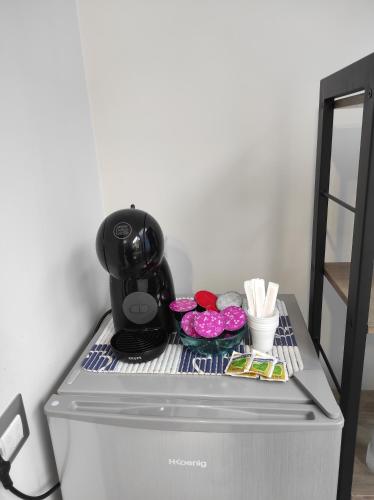 a refrigerator with some food on top of it at Apartment NAPOLI MARADONA in Naples