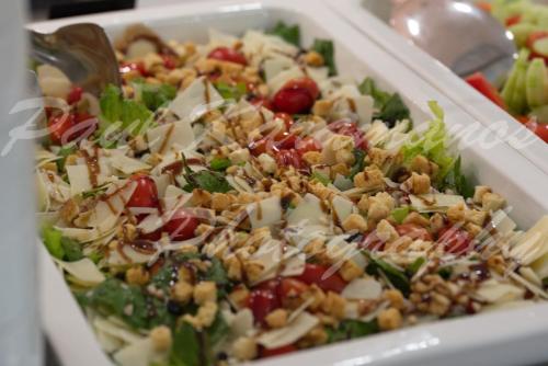 a salad in a white bowl with nuts on it at International Atene hotel in Athens