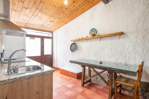a kitchen with a sink and a counter top at Molino de Lucero, casa rural in Teba