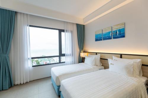 Cama o camas de una habitación en Odin Hotel Quy Nhon