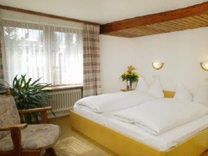 En eller flere senger på et rom på Hotel Garni Seebachstüble