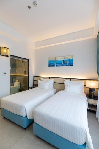 Cama o camas de una habitación en Odin Hotel Quy Nhon