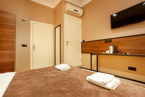 Ένα ή περισσότερα κρεβάτια σε δωμάτιο στο Aram Kerasi Rooms