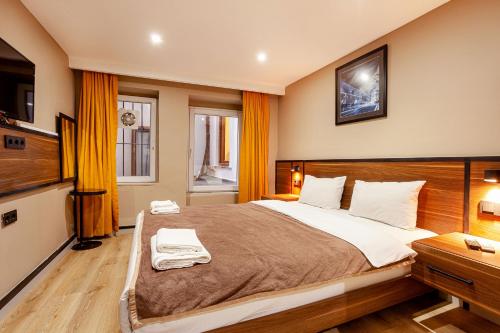 Ένα ή περισσότερα κρεβάτια σε δωμάτιο στο Aram Kerasi Rooms