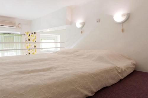 Ένα ή περισσότερα κρεβάτια σε δωμάτιο στο Dora's Calm Nest Over the Chestnut Tree