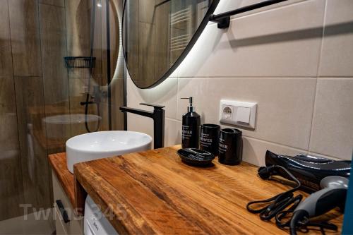 a bathroom with a sink and a mirror at Valley & Mountain View, Twins, with Hot Water in Gudauri
