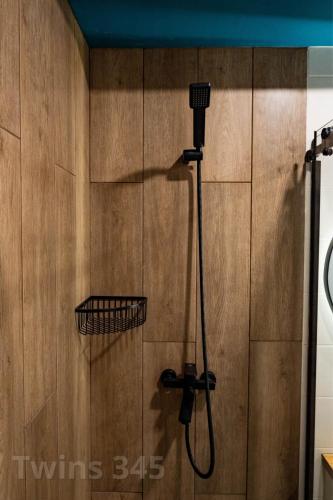 a shower in a bathroom with a shower head at Valley & Mountain View, Twins, with Hot Water in Gudauri
